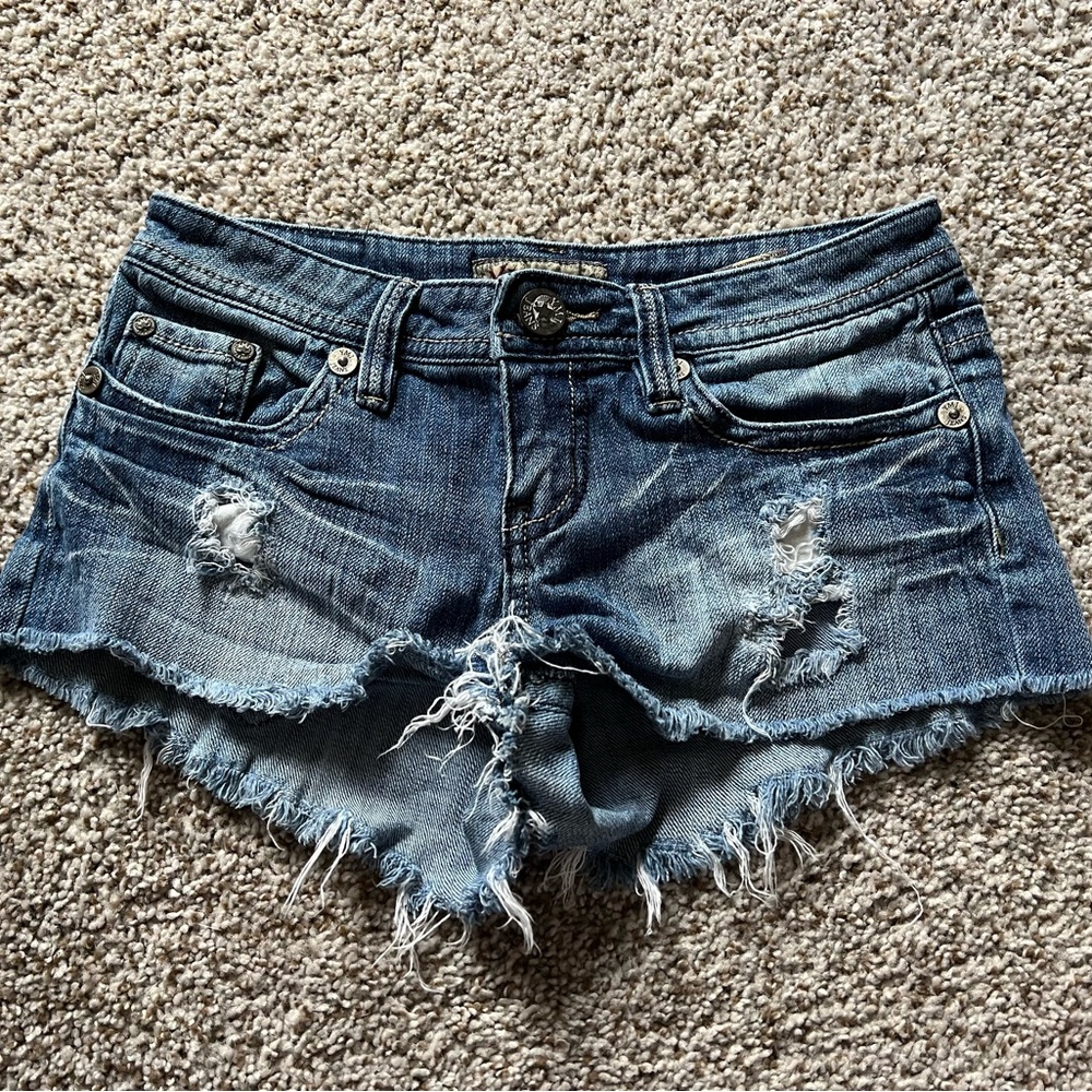 ripped blue jean shorts